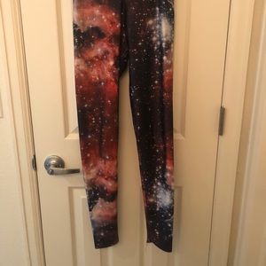 Women’s XS Blackmilk orange galaxy leggings